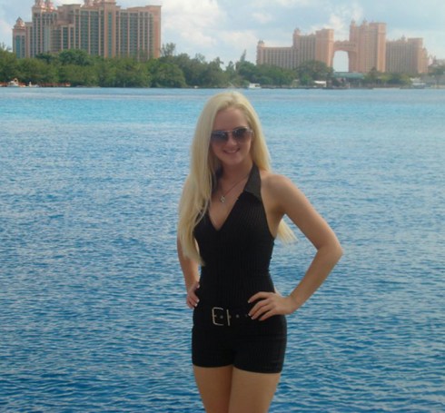 Black and white pinstripe romper in front of Atlantis, Nassua, Bahamas
